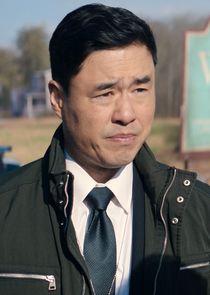 Randall Park
as Agent James E. Woo