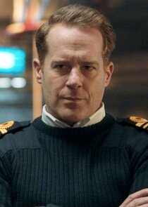 Adam James
as Commander Mark Prentice