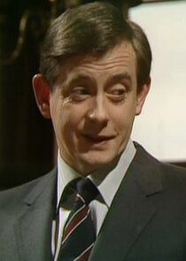 Derek Fowlds
as Bernard Wooley