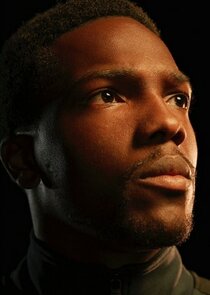 Tosin Cole
as Moses Johnson