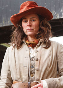 Jill Halfpenny
as Flora