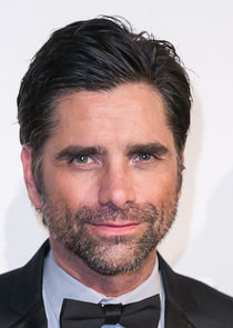 John Stamos
as Elia Peck