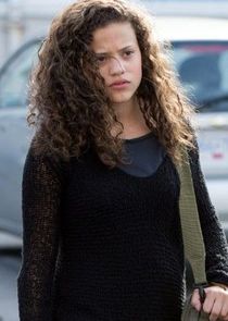 Sarah Jeffery
as Evie Travis