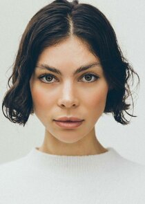 Azizi Donnelly
as Angela Mansour