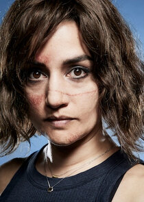 Archie Panjabi
as Asha