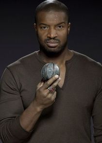 Roger Cross
as Travis Verta