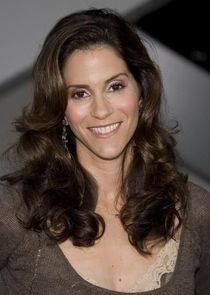 Jami Gertz
as Judy Miller