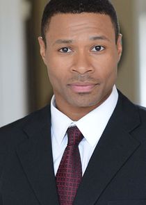 Karon Joseph Riley
as The Handler