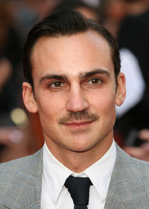 Henry Lloyd-Hughes
as Genec Kurc