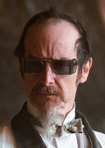 Denis O'Hare
as Dr. Edmund Hague